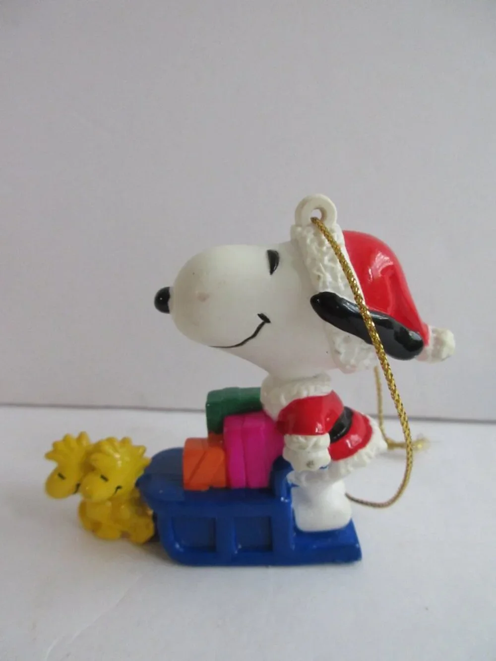 Peanuts PVC Snoopy Santa On Sleigh with Gifts, Woodstock Reindeer 2.5” Ornament